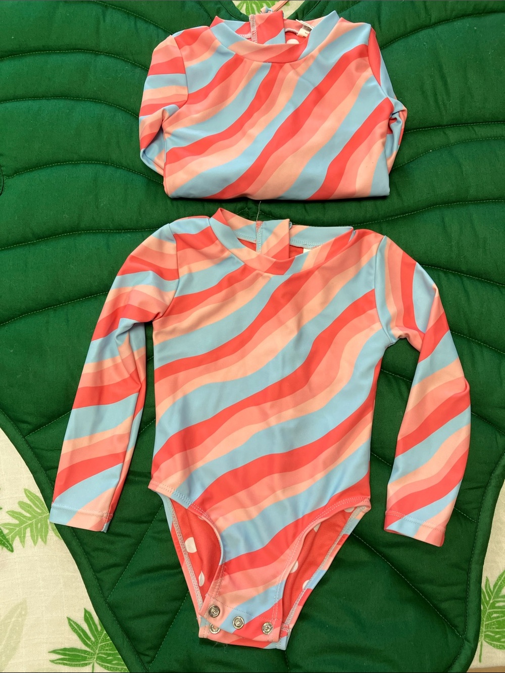 F4A Feather 4 arrow one piece long sleeve wave chaser rashguard swimsuit. Pink